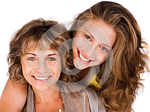 Close-up of smiling elder mum and daughter