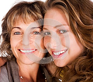 Close-up of smiling elder mum and daughter