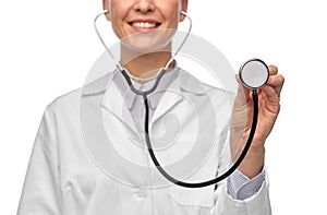 close up of smiling female doctor with stethoscope