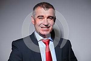Close up of a smiling middle aged business man
