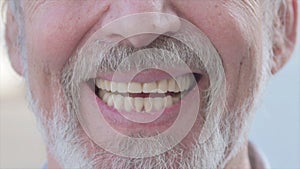 Close Up of Smiling Old Man Lips Outdoor