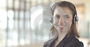 Close-up of smiling woman promo in a call center customer service