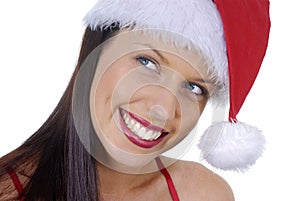 Close up of smiling young adult woman with red Christmas Santa hat isolated on white background