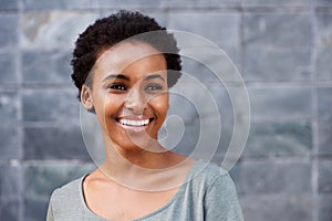 Close up smiling young black female fashion model