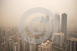 close-up of smoggy city skyline, with tall buildings obscured by toxic haze