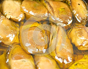 Close up of smoked oysters or mussels