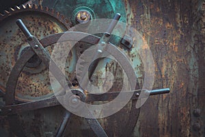 Close-up snapshot of ancient gears mechanism, Steampunk background. photo