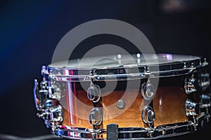 Close-up of a snare drum, percussion instrument on a dark background, copy space