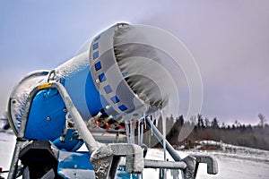 Close up snow cannon making snowflakes