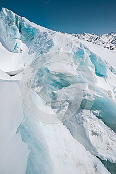 A close-up of snow-covered cracks in the Elbrus volcano glacier. North Caucasus