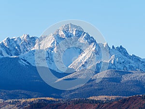 Close up of snow covered Sneffels Range in a bright daylight blu photo
