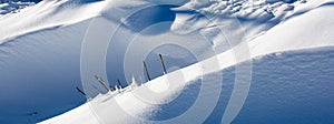 Close-up of snow drifts and natural shadows in December