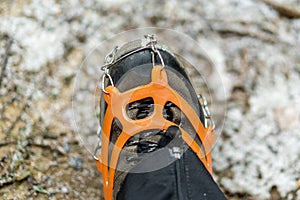 Close up of snow shoes and shoe spikes in winter.