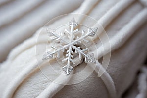 Close-up of a snowflake on a wool mitten