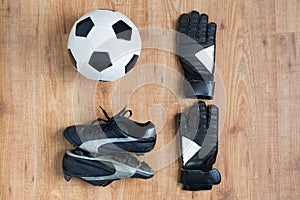 Close up of soccer ball, boots and gloves