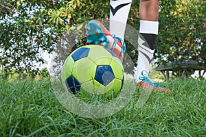 Close up of a soccer ball and a feet of a soccer player 2