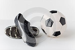 Close up of soccer ball and football boots