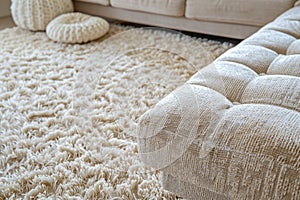 close up of sofa with beige carpet rug home interior background