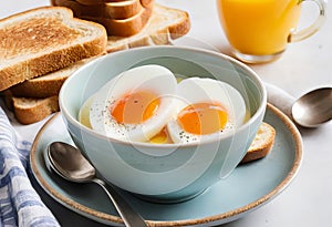 A close-up of a soft boiled egg in a cup with a slice of toast on the side