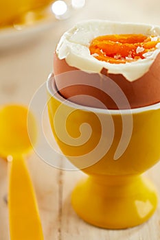 Close-up on soft-boiled egg in eggcup