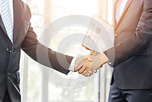 Close Up of soft focus two young business man hands people shaking hands, finishing up a meeting Greeting Deal Concept