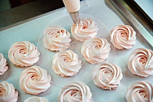 Close-up soft zefir marshmallow with fruit taste lying on baking paper