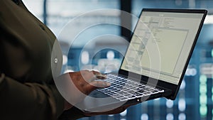 Close up of software developer working in data center to optimize network