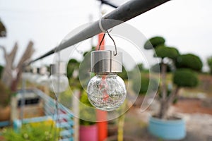 Close up solar cell vintage light bulb for lighting at the backyard