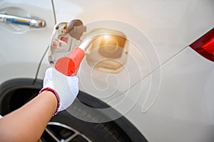 Close-up of some fuel pump nozzles at a gas station or a car filling station