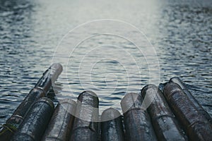 Close up of some part bamboo raft on the lake