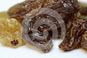 Close up of Some Sultanas on White Background