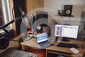 Close-up of the sound engineer, radio presenter office in recording and broadcasting studio. Focus on microphone