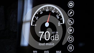 Close-up of sound level meter screen in decibels. Modern electronic sound meter around photo