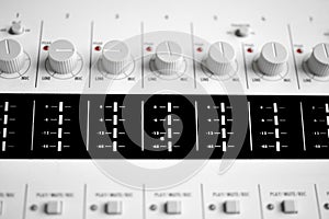Close up of a sound mixer knobs photo