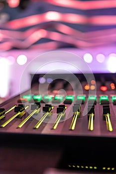 Close up, sound music mixer control panel on blurred background.