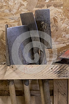 Close-up of spades, garden tools, stored in a wooden shed