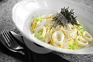 Close up spaghetti and squid sauce