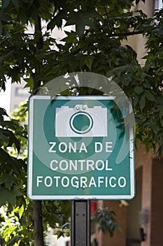 Close up of a spanish No Photography Zone sign attached to a post at Santiago de Chile photo