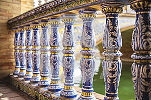 Close up of spanish tiles on handrail at Plaza de Espana, Seville, Spain