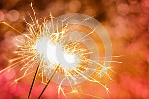 Close-up of sparklers on bokeh background