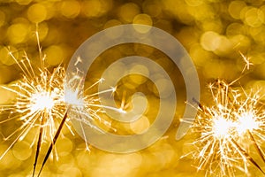 Close-up of sparklers on bokeh background