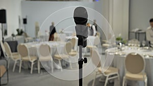 Close-up Speaker Microphone speaking conference blurred background