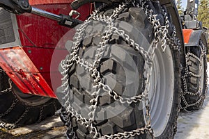 Close up of special snow chains with spikes on a wehicle