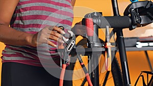 Close up of specialist preparing work tools, patching up faulty bicycle parts