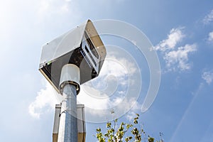 Close-up on speed trap surveillance camera along highway