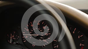 Close up of speedometer mph gauge of car accelerating