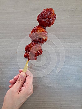 close-up of spicy chicken karaage skewer