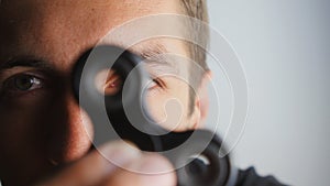 Close up spinner or fidgeting hand toy rotating on man`s hand