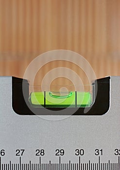 Close-up of a spirit level in the shell of a home, portrait format