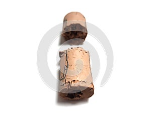 Close up of split wine bottle cork. Pieces of bottle cap on white background. Corks isolated on white background. Old cork stopper